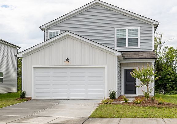 Raven Exterior TD102 features siding, covered front door and 2 car garage