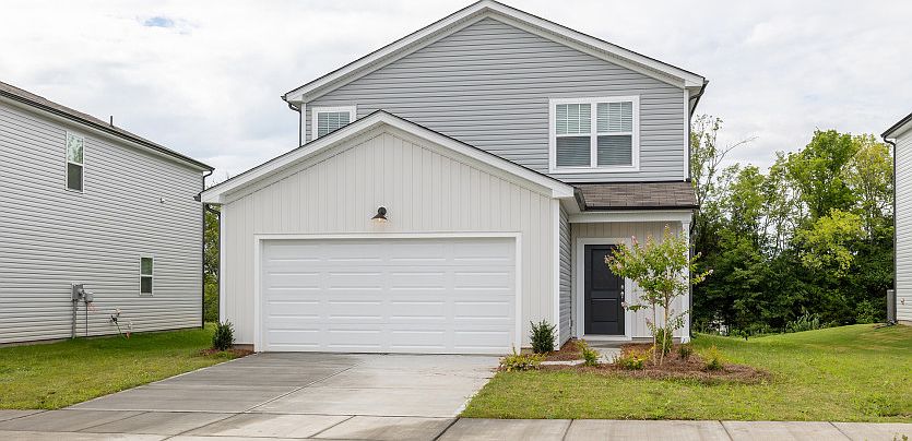 Raven Exterior TD102 features siding, covered front door and 2 car garage