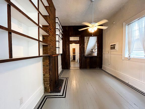 Dining room area from the front of the house leading to the kitchen.