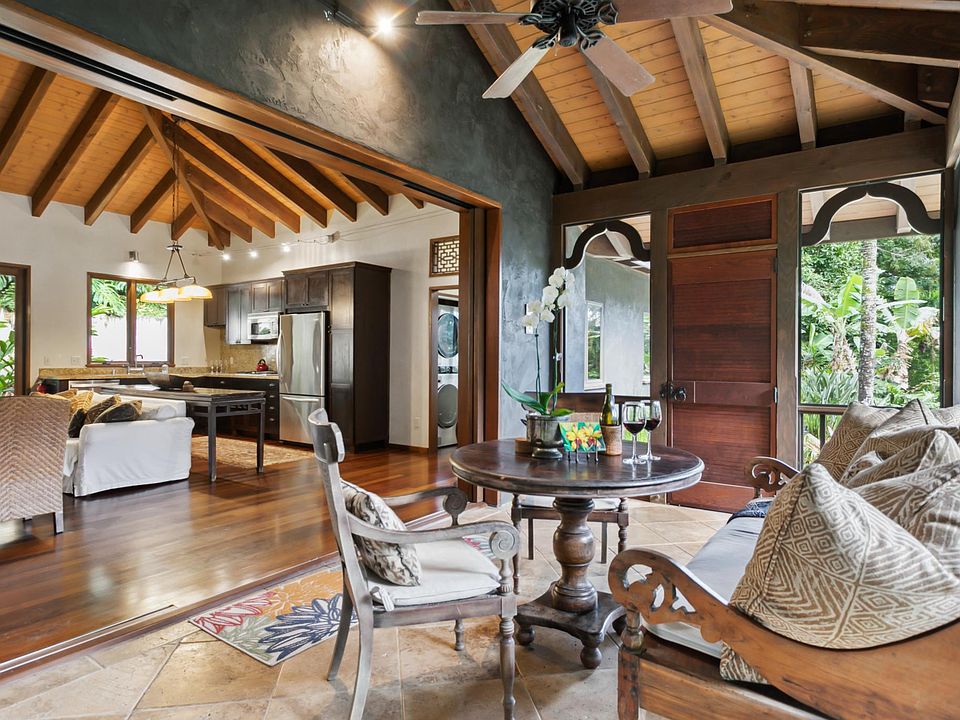 Screened Lanai - looking into great room, opening has very large wood pocket doors to totally close off lanai
