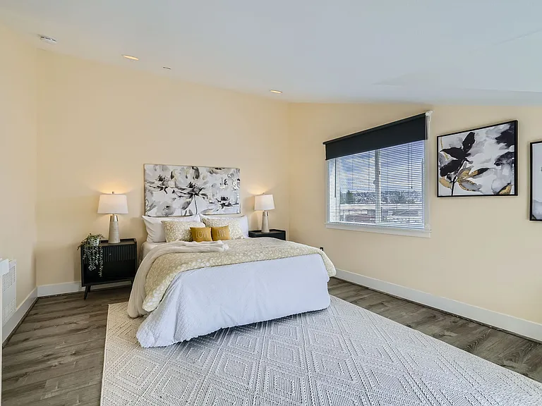 Primary bedroom suite has vaulted ceilings