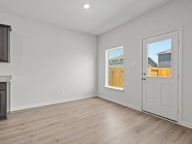 The dining room has a large window that lets in great, natural light.