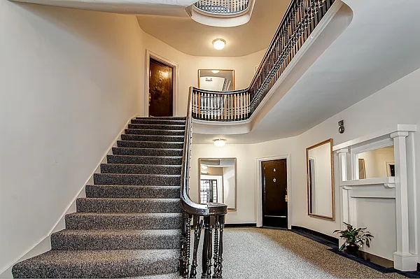 Gracious building foyer with beautiful period stairway.