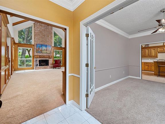 As you enter the home you will appreciate the huge family room with the two story brick fireplace.