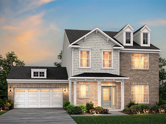Foxfield Exterior 8 features brick, shakes and covered front porch