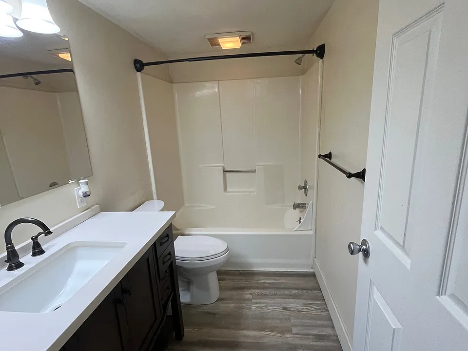 large vanity, with shower, tub combo.