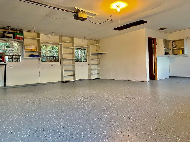Inside the detached 2-car garage
with automatic garage door opener, electricity, lots of storage space, plus an office with heater.
