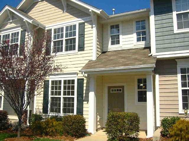Front of this beautiful home w/square columned covered porch