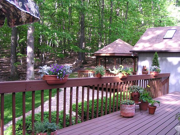 Relaxing deck backs to woods