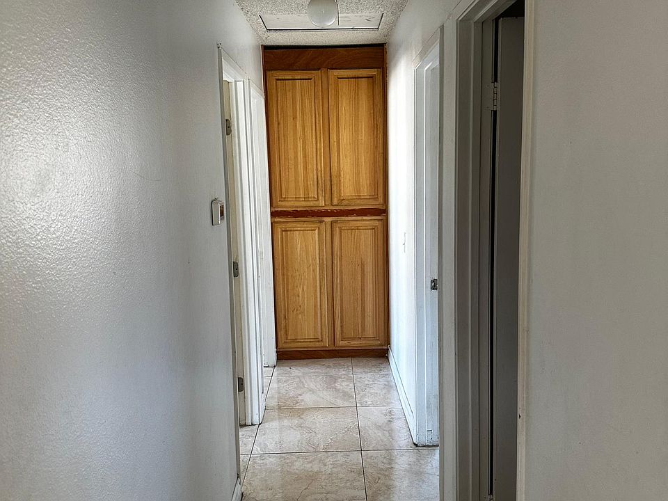 Hallway, first door to right is Restroom. Then master bedroom after. To the left two doors are for each bedroom. End is a small linen Closet.