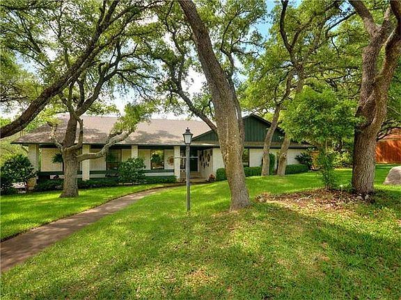 Plenty of open space, green manicured lawns and well water irrigated front yard. Sprinkler system
