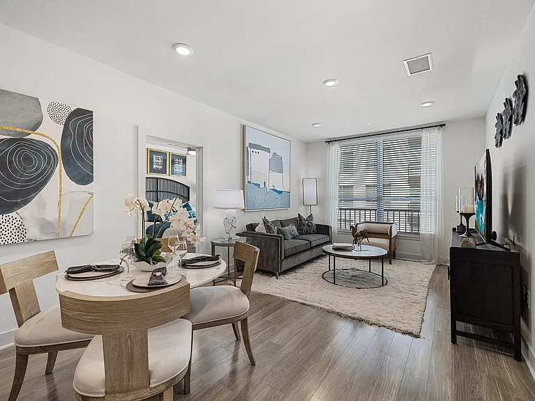 Dining nook with round table connecting to living space