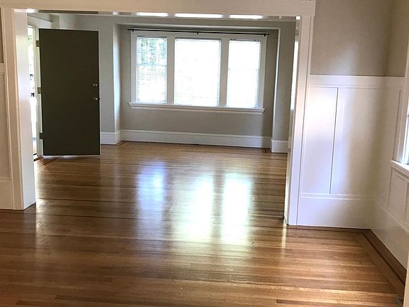 Dining room, looking toward large living room and entry door