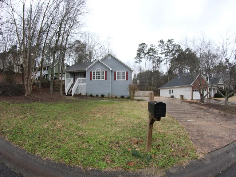 Front of house with long driveway