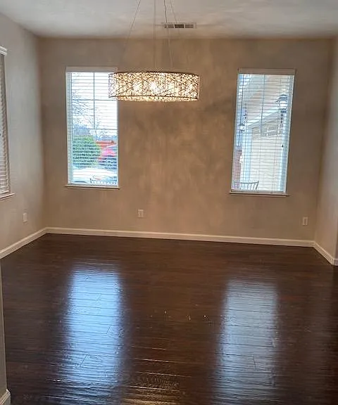 Dining room with brand new chandelier & engineered floor