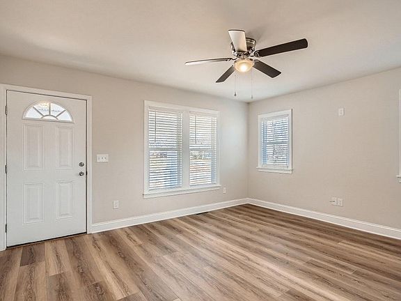 Living room has ceiling fan light. New windows throughout.