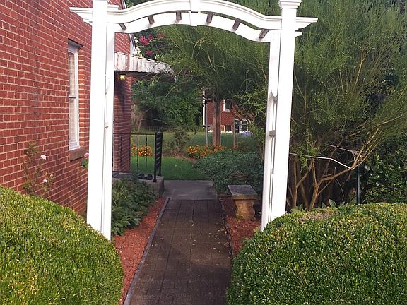 Walkway from driveway to side door with direct access to the kitchen