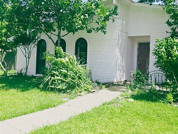View of front of property with a front lawn and brick siding