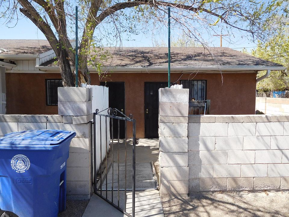 The front of the apartment with the yard and the apartment on the right. D