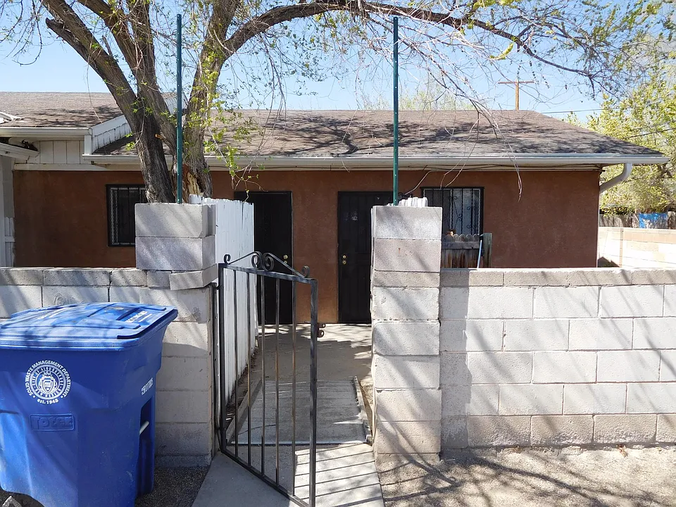 The front of the apartment with the yard and the apartment on the right. D