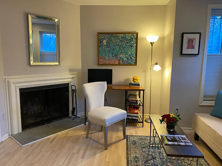 TV and fireplace in sitting room.