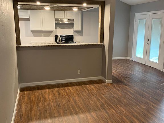 Kitchen bar facing one of two living rooms