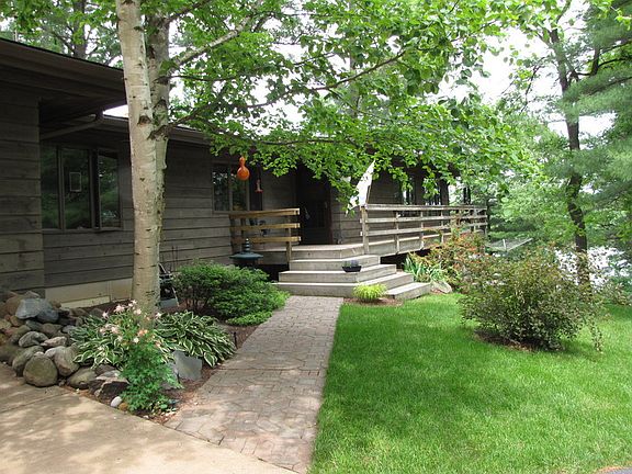 Front entry viewed from driveway by garage