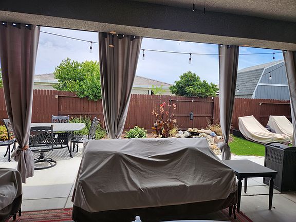 Patio with fireplace and koi pond