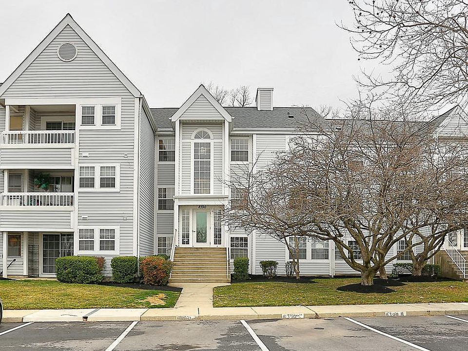 Main Building Entrance and Assigned Parking