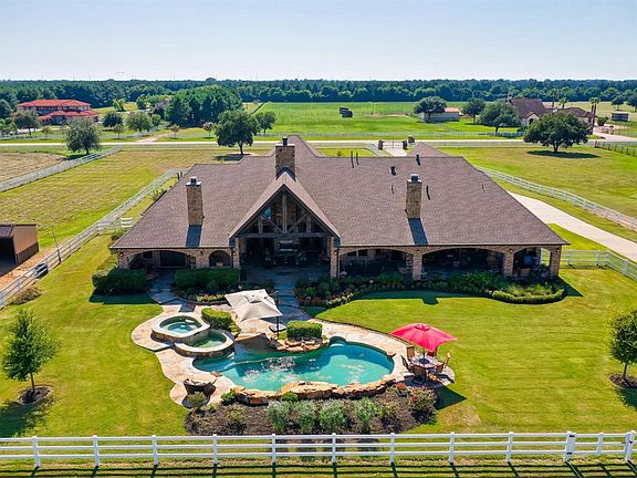 Lovely salt water pool with double spa. Master suit with private patio has pool access as seen on the left. Also off the main living area the cathedral ceilings continue on the patio with outdoor kitchen and entertaining space leading to the pool as 