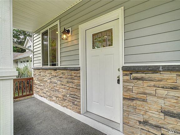 A darling covered front porch to sip your morning coffee on. 