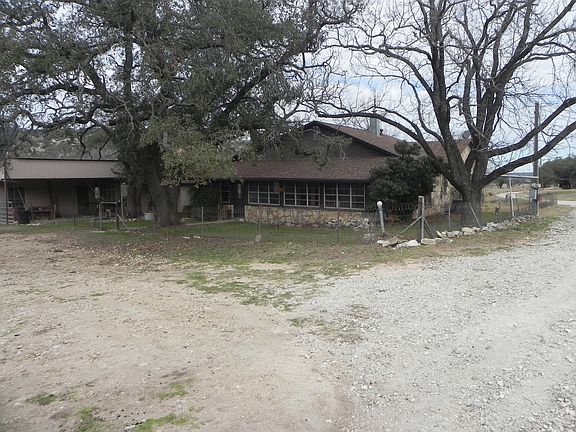 Back of house with enclosed porch