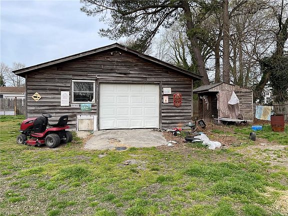 Detached garage, out building/shed to right