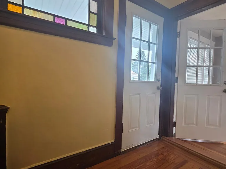 Welcome guests from your charming front entrance, leads to balcony and living rooms