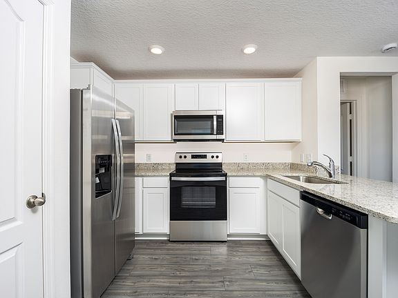 The spacious kitchen is perfect for preparing your family s favorite meals and treats.