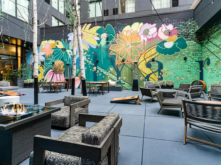 A vibrant courtyard gathering spot at Echo Street West, near Modera Westside Trail_perfect for relaxed hangouts surrounded by Atlanta's creative energy.