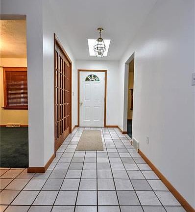 Handsome wood details and a tile entry welcome your arrival to this spacious floor plan.