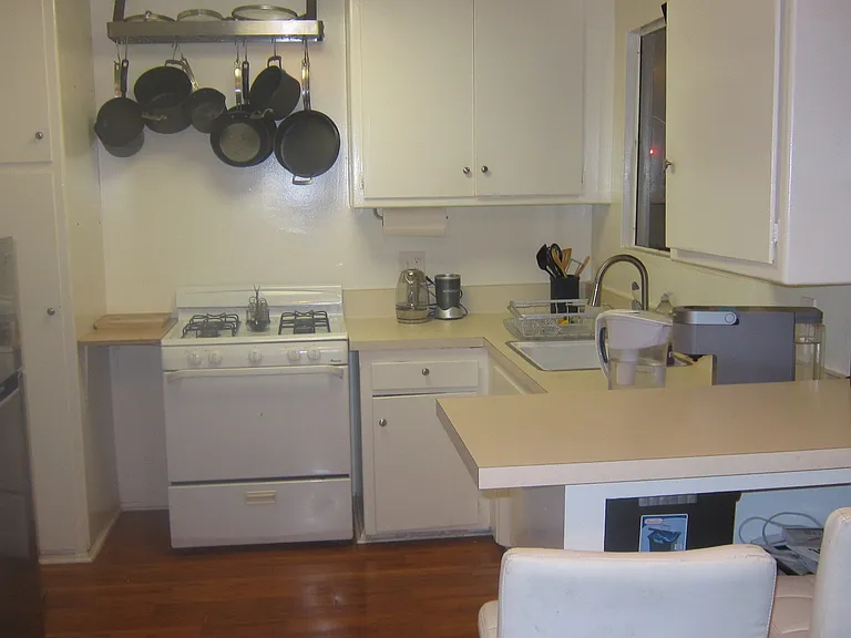 Limited Kitchen Privileges. Light cooking, Microwave, Oven, Pod coffee maker. Barstool with counter top.