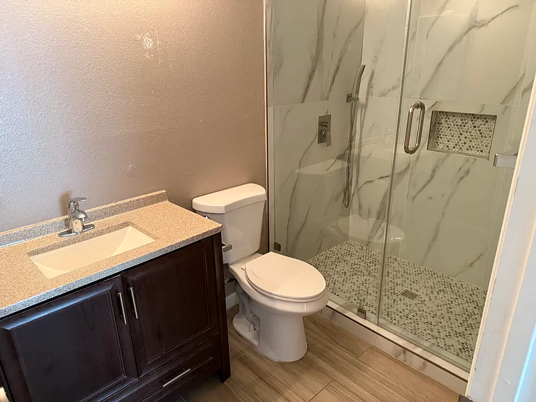 Primary bath before new mirror above vanity.