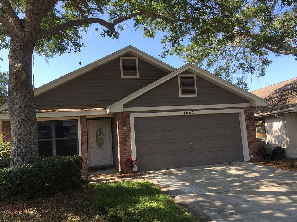 2 car garage and shaded drive