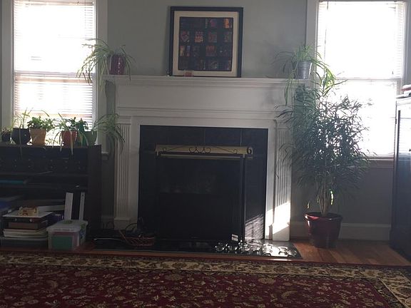 Cozy living room with hardwood floors and fireplace