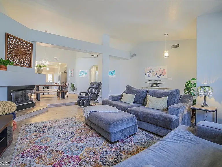 Sunken living room looking towards dining area and kitchen.