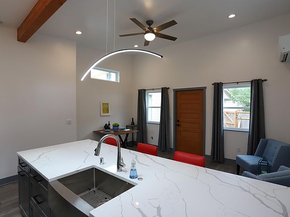 Open concept, vaulted ceilings, skylights, new quartz countertops, and all new appliances!
