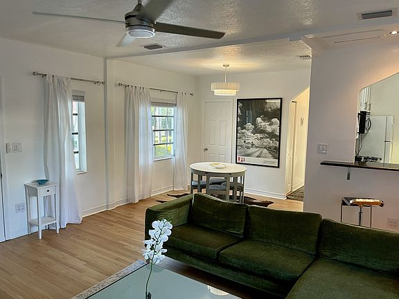Living Room/ Newly Furbished White Oak Hardwood Floors, New window hardware, New blinds throughout unit