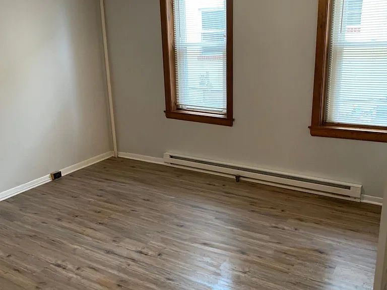 Spacious bedroom with 2 large windows