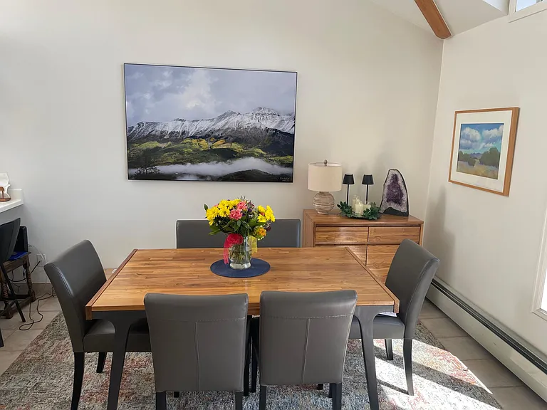 Dining area. Additional chairs on back deck. Dining table has 2 leaves to seat 10-12.