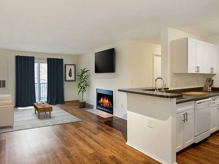 Classic Package kitchen, living, and dining areas with hard surface plank flooring