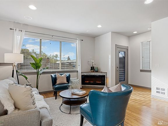 Electric fireplace nestled in the corner on the main floor.