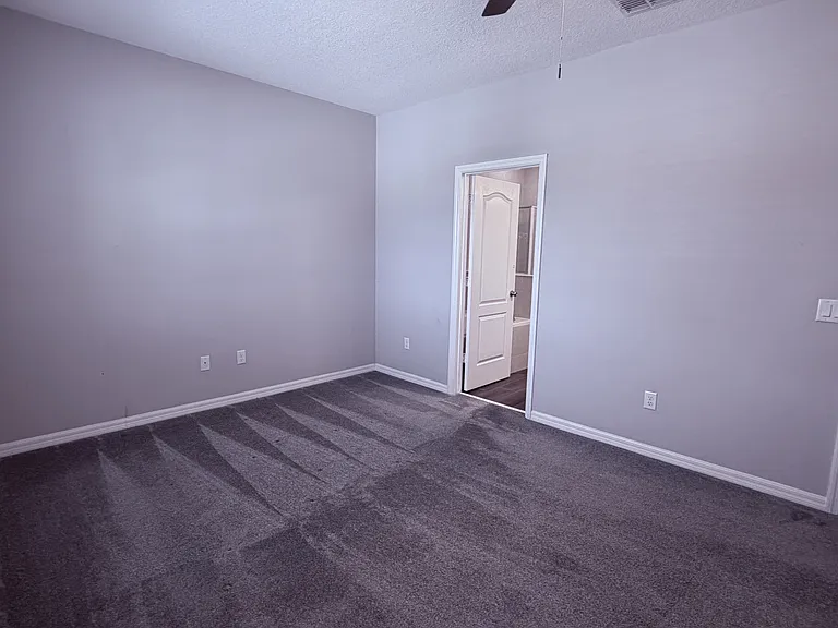 Master bedroom showing entrance to master bath and exit to loft