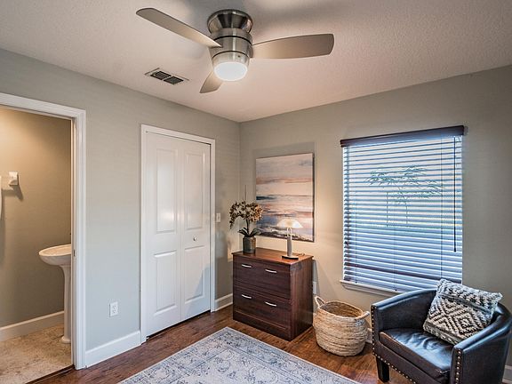 First floor bedroom. Features a deep closet, attached half bath, and is great for a home office.
